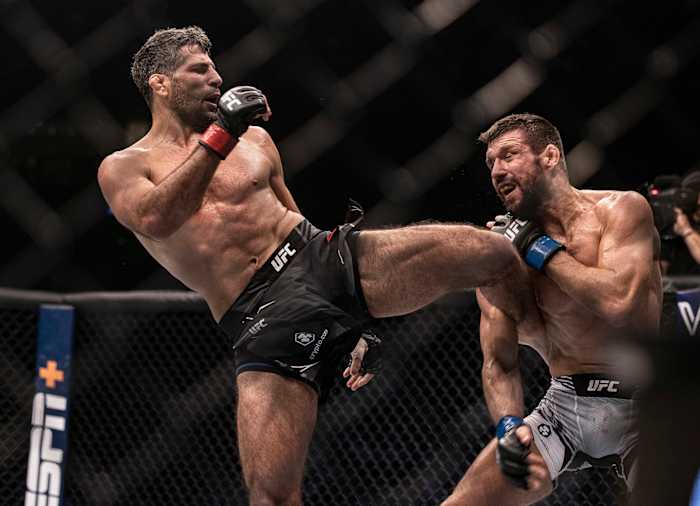 Beneil Dariush (red gloves) and Mateusz Gamrot (blue gloves) during UFC 280 at Etihad Arena.